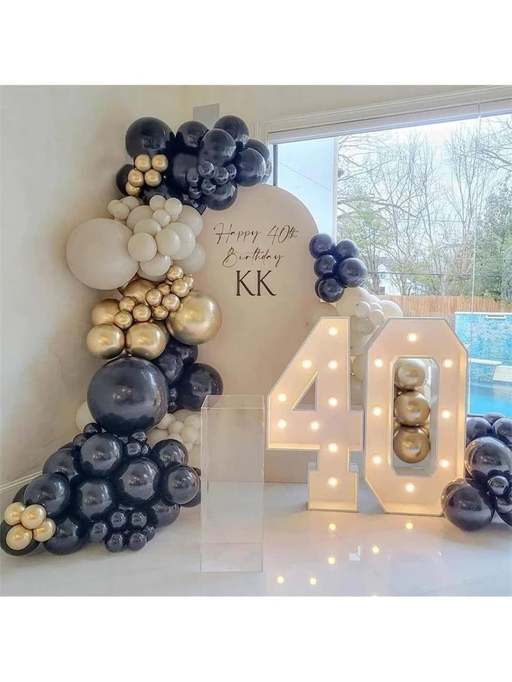 balloons are arranged in the shape of letters and numbers for an anniversary party or celebration