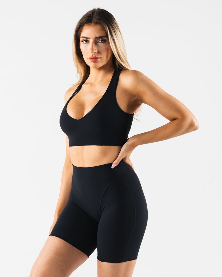 HIGHLIGHTS. A/B/C cup Deep V neckline Racer back Buttery soft High sweat Medium impact FIT SUGGESTION. This item runs true to Alphalete's tight fit... Skylar is 5’7”/170.2cm, wearing a size S. with 34.5"/87.6cm bust. Hannah is 5'11"/180.3cm, wearing a size L with a 40"/101.6cm bust. MATERIALS AND WASHING DIRECTIONS. 70% Nylon, 30% Spandex. We recommend washing inside-out on a cold setting. Hang to dry DESCRIPTION Extreme high stretch meets a buttery soft hand-feel to make this fabric the perfect Sleek Activewear With Built-in Bra For Gym, Workout Sports Bra Made Of Elastane, Elastane Sports Bra For Workout, V-neck Elastane Activewear For Workout, Sleek Gym Activewear With Built-in Bra, Sleek Activewear With Built-in Bra For Sports, Sleek Activewear With Built-in Bra And Stretch, Sleek Activewear With Built-in Bra, Sleek Yoga Activewear With Built-in Bra