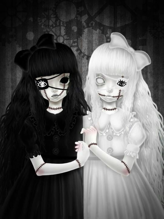 two girls dressed up in halloween costumes standing next to each other with their hands together