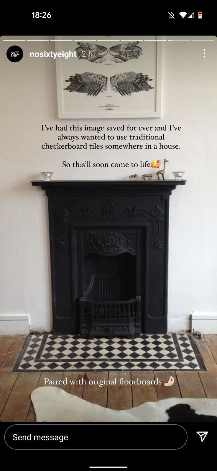 an image of a living room with a fireplace and black and white tile flooring