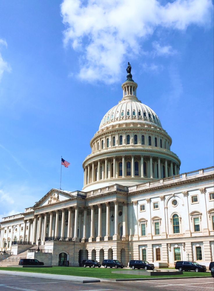 the u s capitol building in washington, d c is pictured on a sunny day