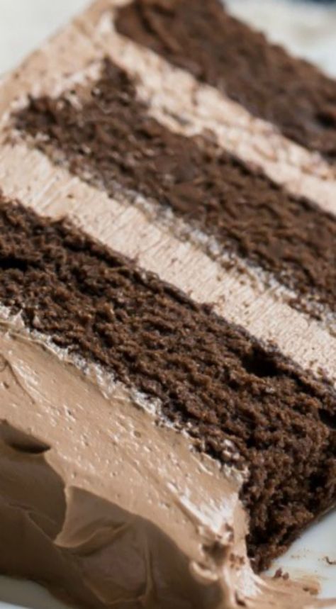 a close up of a cake with chocolate frosting