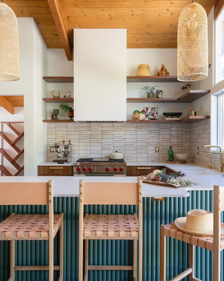 an open kitchen with wooden shelves and stools