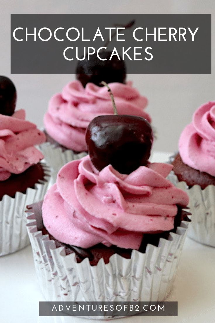 chocolate cherry cupcakes with pink frosting and cherries