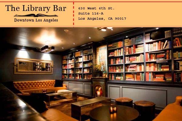 a library with tables, couches and bookshelves