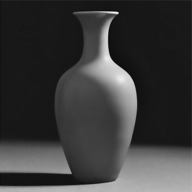 a white vase sitting on top of a table