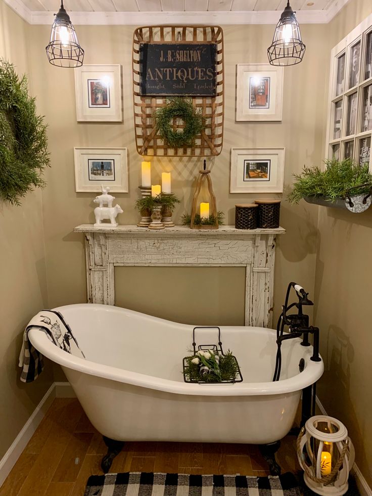 an old fashioned bathtub in the corner of a room with pictures on the wall