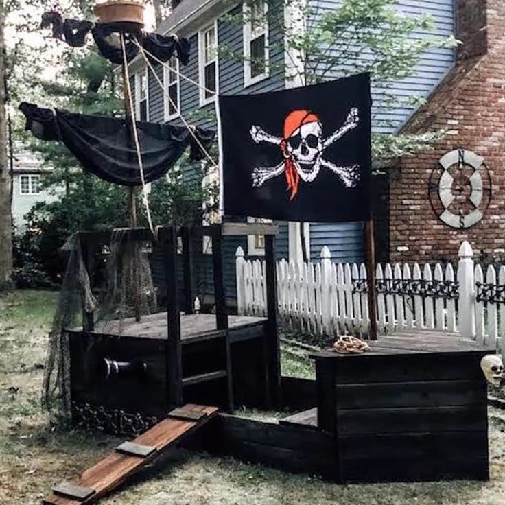 a pirate flag is on display in front of a house