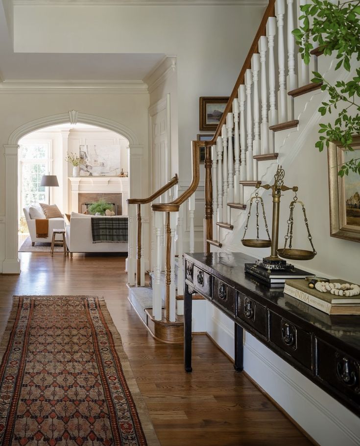 an entry way leading to a living room and dining room