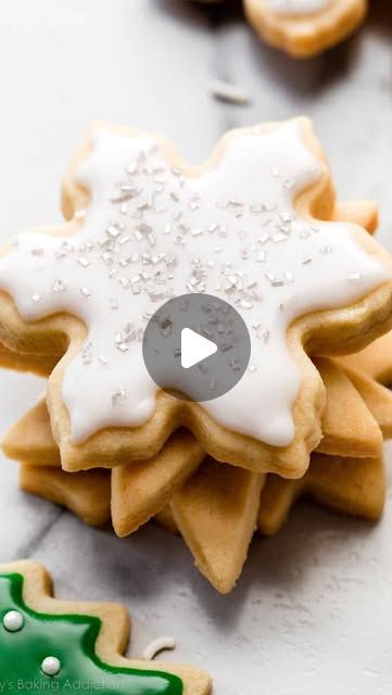 cookies decorated with white icing and sprinkles