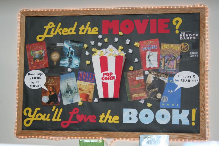 a chalkboard with movie related items on it and an advertise for popcorn