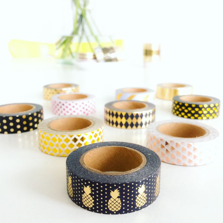 several rolls of washi tape with pineapples on them sitting on a table