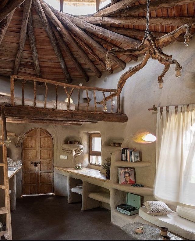 the interior of an old style house with wood beams