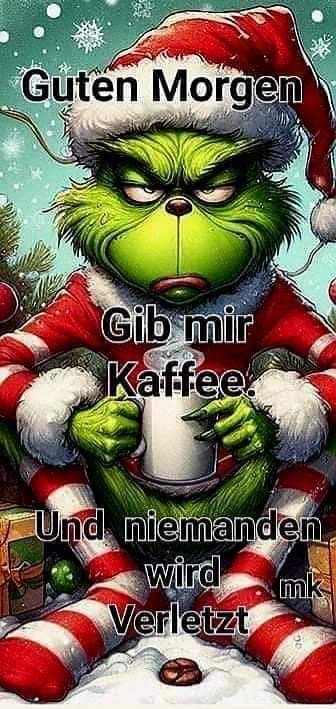 the grinch is holding a cup in his hands