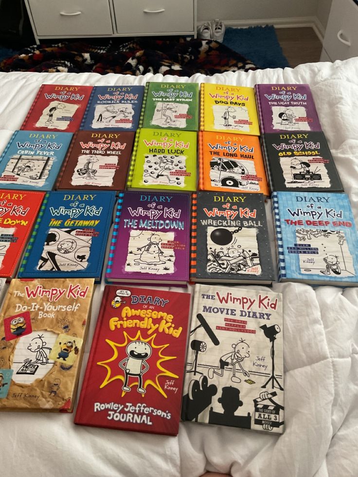 there are many children's books on the bed