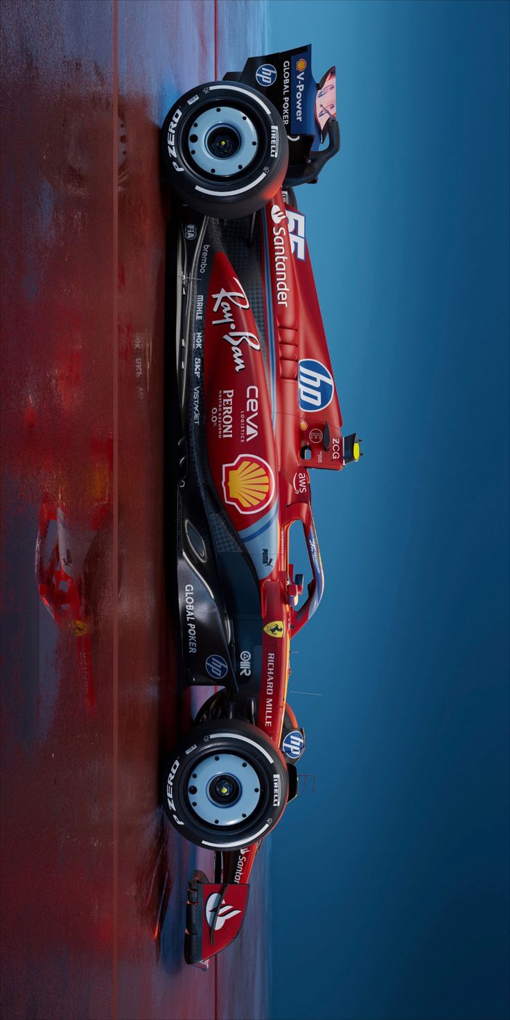 a red race car sitting on top of a blue wall