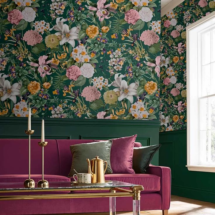 a living room with floral wallpaper and purple couch