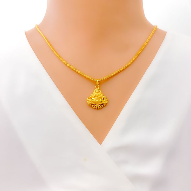 Elevate your festive look with our Impressive Festive 22k Gold Lakshmi Pendant. Crafted from exquisite 22k gold and weighing 4.1 grams, this pendant radiates elegance and spirituality. The intricate design showcases Goddess Lakshmi, the symbol of wealth and prosperity. With a pendant length of 1 inch, it's the perfect adornment for your special occasions. Please note that the chain is not included, giving you the freedom to pair it with your preferred chain. PRODUCT DETAILS Gold Purity(karat): 2 22k Gold Temple Necklace Pendant For Festivals, Yellow Gold Pendant Temple Necklace For Festive Occasions, Festive Yellow Gold Pendant Temple Necklace, Festive 22k Gold Temple Necklace With Pendant, 22k Gold Pendant Temple Necklace For Festivals, 22k Gold Temple Necklace For Navratri Gift, 22k Gold Hallmarked Temple Necklace For Diwali, Hallmarked Gold Plated Temple Necklace For Diwali, Diwali 22k Gold Hallmarked Temple Necklace