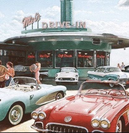 several classic cars are parked in front of a drive - in restaurant on the beach