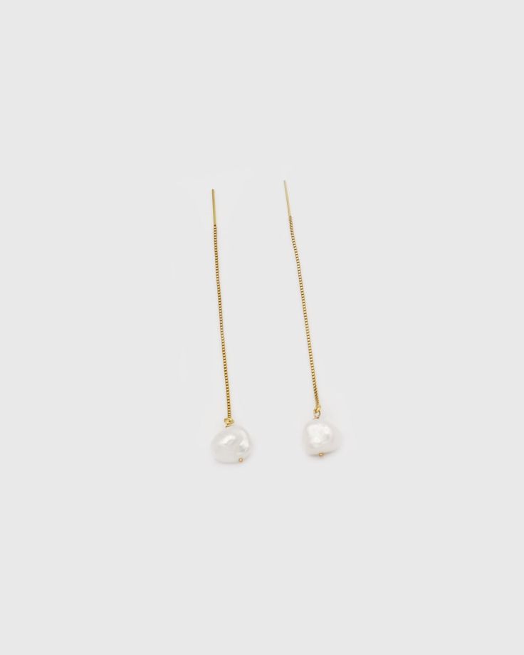 Meet these elegant and classic pearl threader earrings. Handcrafted in gold-filled threader earrings with freshwater pearls. Each pearl is handpicked to let the unique shape shine through. Each pearl is unique and slightly varies in size and shape — and that's the beauty of it. …………………………………. I T E M D E T A I L S • Sold as a pair • Threader length is 80mm (without the pearl) • Pearl is genuine freshwater Keshi pearl (10 x 9 mm)• Tarnish-resistant, showerproof, safe for sensitive ears • 14K Gold Yellow Gold Long Drop Threader Earrings With Pearl Drop, Yellow Gold Threader Earrings With Pearl Drop, Classic Gold Long Drop Threader Earrings, Gold Threader Earrings With Pearl Drop For Formal Occasions, Formal Gold Threader Earrings With Pearl Drop, Classic White Pearl Drop Threader Earrings, Classic White Threader Earrings With Pearl Drop, Pearl Drop Threader Earrings, Pearl Drop Threader Drop Earrings As Gift