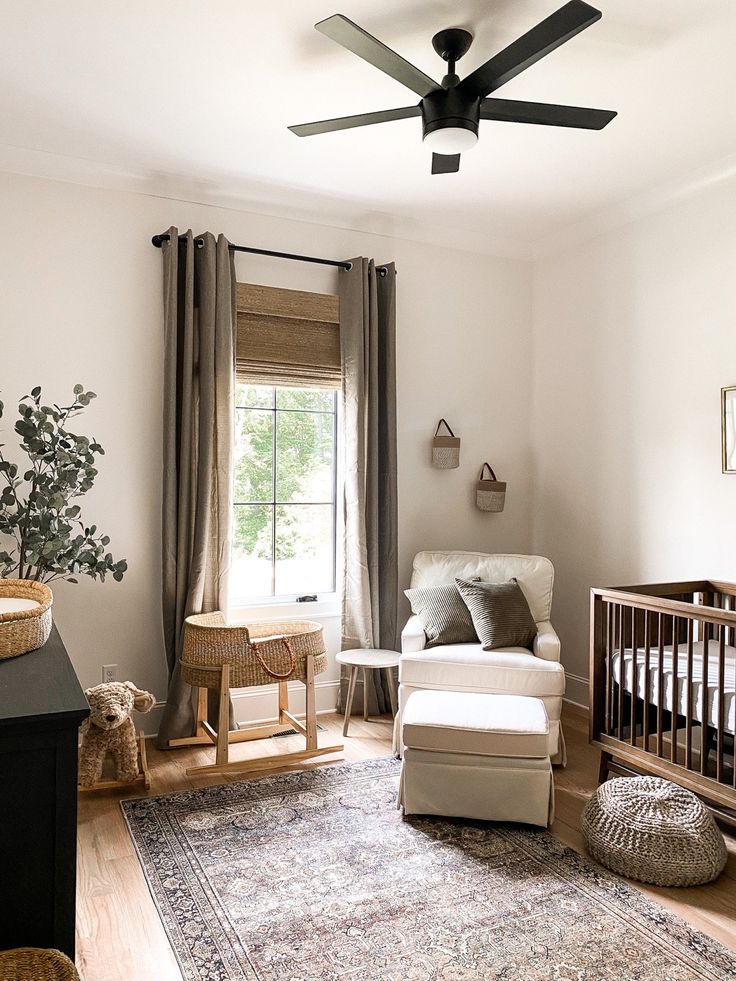 a baby's room with a crib, rocking chair and rug