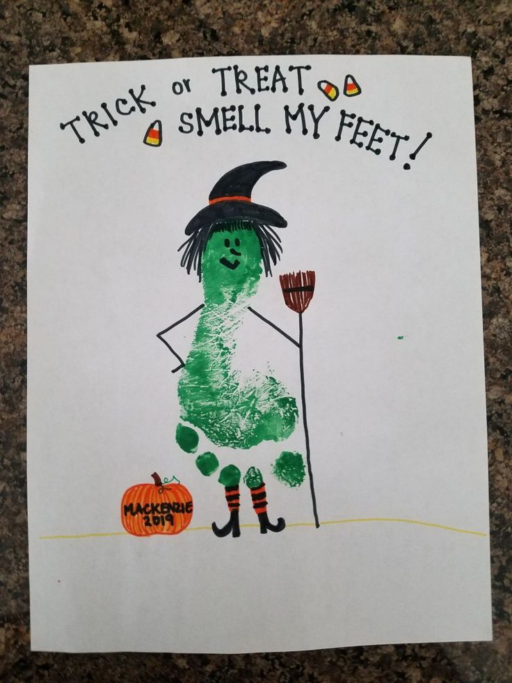 a child's handprinted halloween card that says trick or treat smell my feet