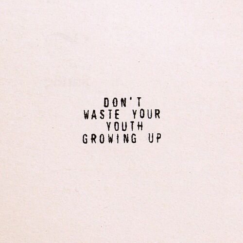 the words don't waste your youth growing up are written in black on a white paper