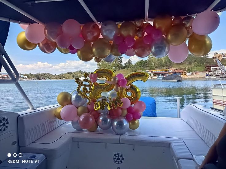 balloons and decorations on the back of a boat