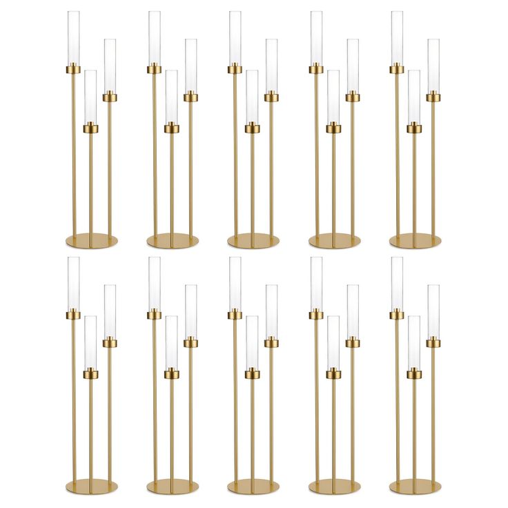 six brass and clear glass floor lamps, each with different shades on the bases in various sizes