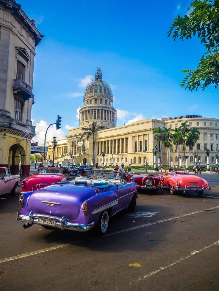 classic cars parked in front of the capitol building