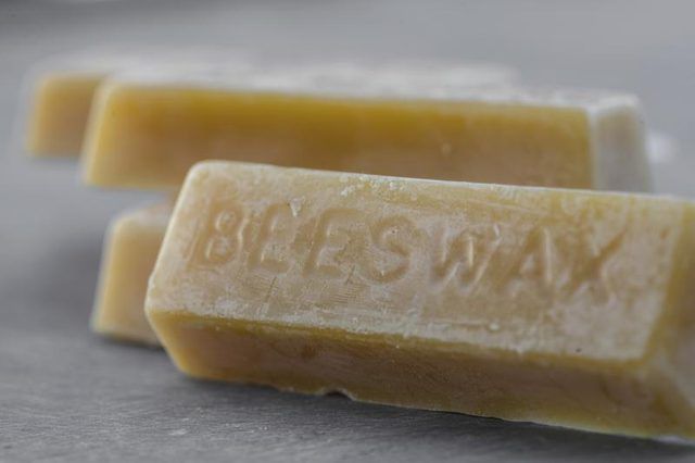 two bars of soap sitting on top of a counter next to each other with the word blisswax written on it