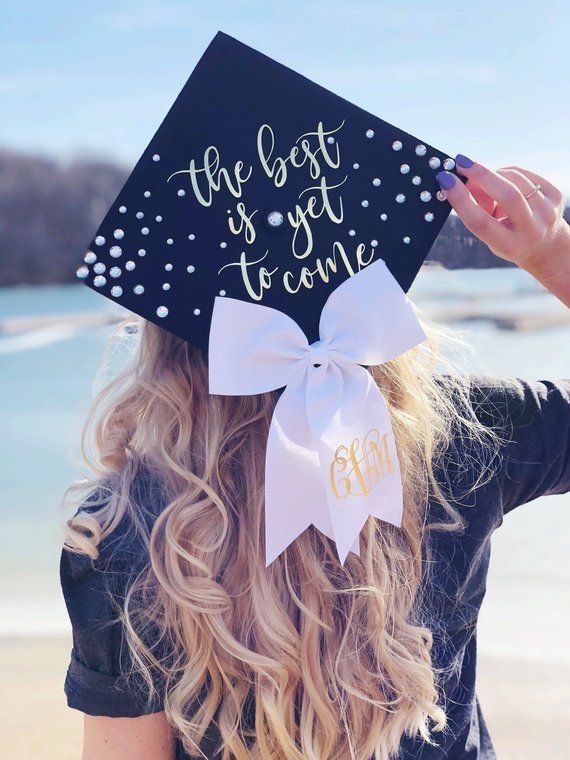 a woman wearing a graduation cap that says the best is yet to come