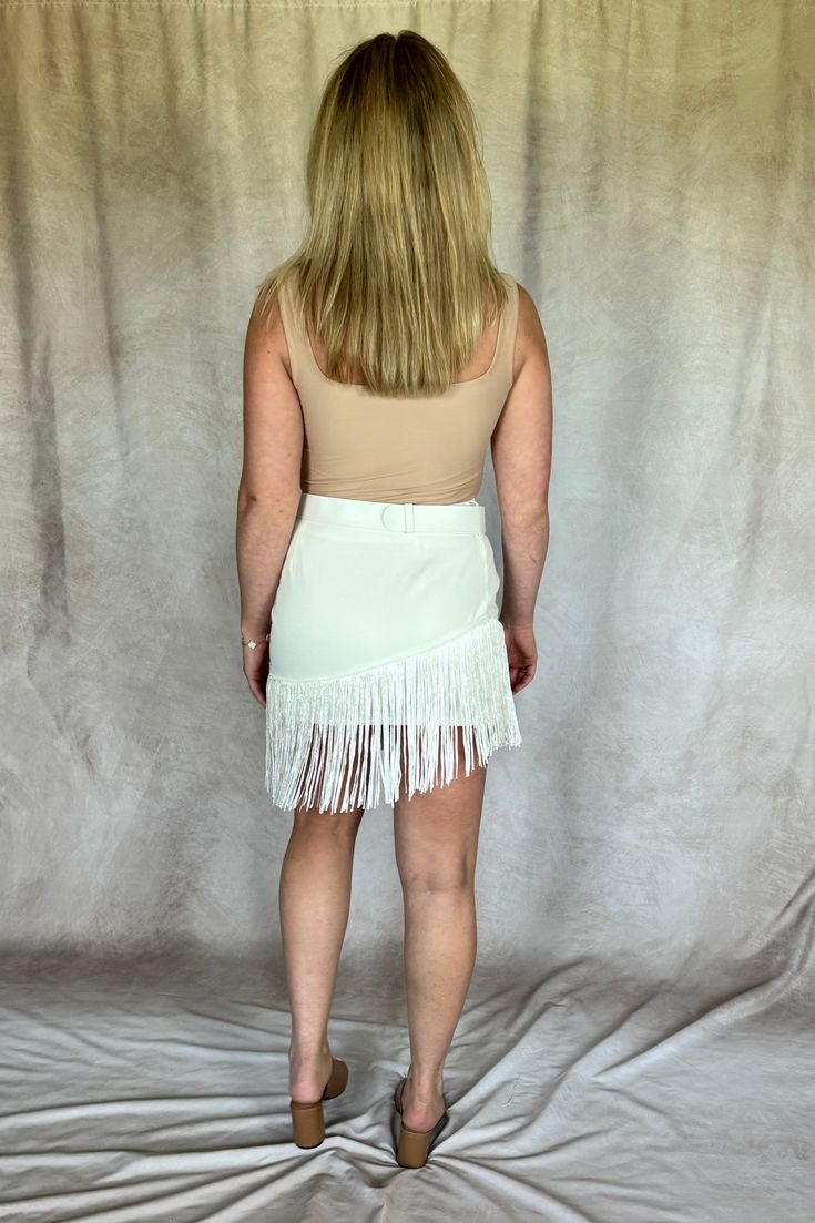 Fringe Skirt A-Symmetrical fringe Hidden side zipper Belt included Lined Fit is True to Size *Note: Belt gets wrapped around the buckle then tucked back thought loop. Loop may need to be shifted. 60% Polyester35% Rayon5% Nylon Zipper Belt, Fringe Skirt, Wrap Around, Short Tops, Rodeo, Side Zipper, Jacket Dress, Jumpsuit Romper, Dress Shop