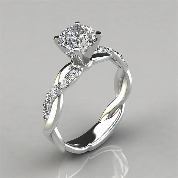 a white gold engagement ring with diamonds on it