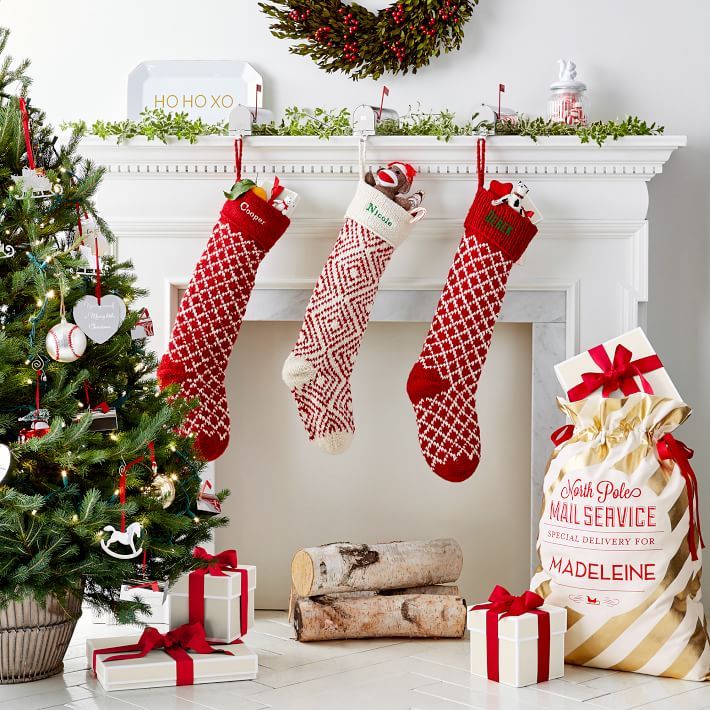 christmas stockings hanging from a fireplace mantel