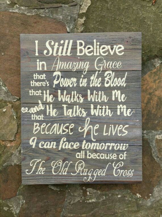 a wooden sign that says i still believe in amazing grace