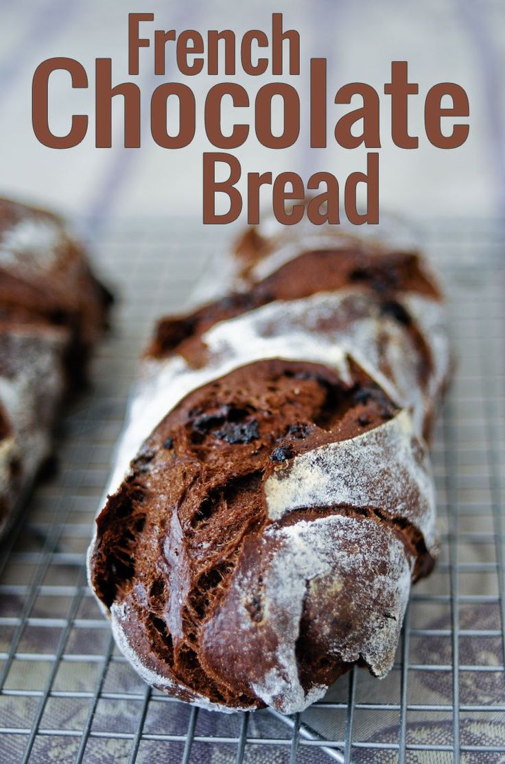 a loaf of chocolate bread sitting on top of a cooling rack with the words french chocolate bread