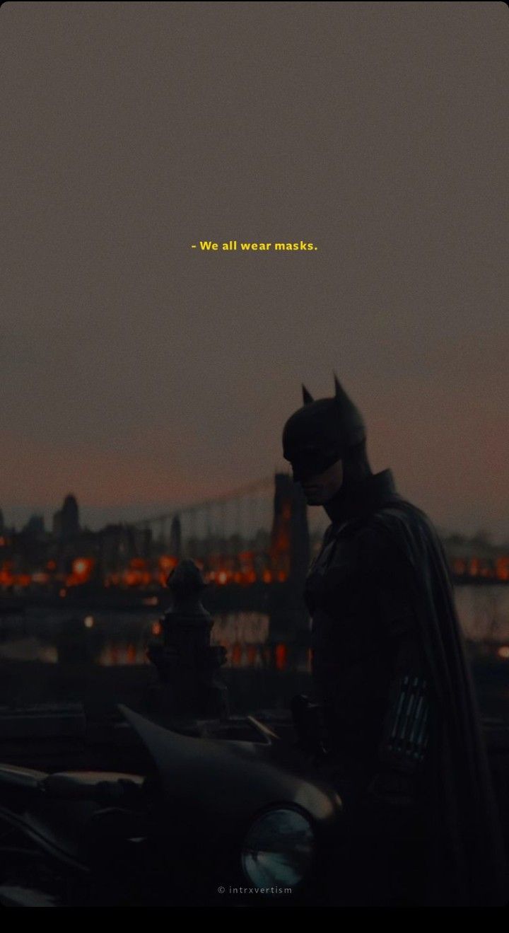 the dark knight is standing in front of a cityscape with an inscription that reads, we all wear masks