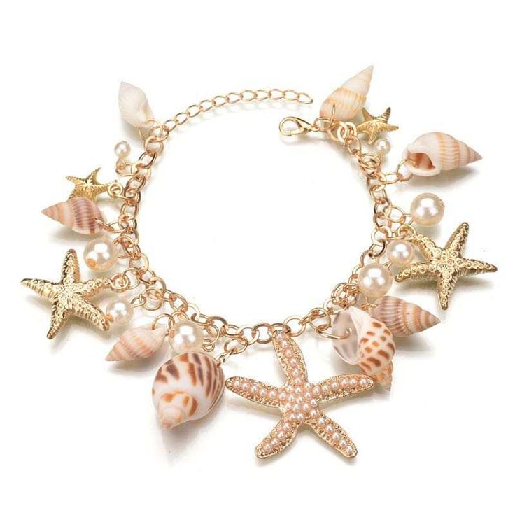 Introducing our charming Multi Starfish Sea Star Conch Shell Simulated-Pearl Beach Bracelet, a perfect accessory for capturing the spirit of the ocean and adding a touch of beachy elegance to your ensemble. This bracelet features a delightful mix of starfish, sea stars, conch shells, and simulated pearls, all intricately combined to create a stunning piece that evokes the beauty of the sea. The real shells add an authentic, natural touch, while the alloy elements provide durability and a polishe Ocean Bracelet, Seashell Bracelet, Pearl Charm Bracelet, Stella Marina, Starfish Bracelet, Starfish Necklace, Amber Ring, Shell Bracelet, Styl Boho