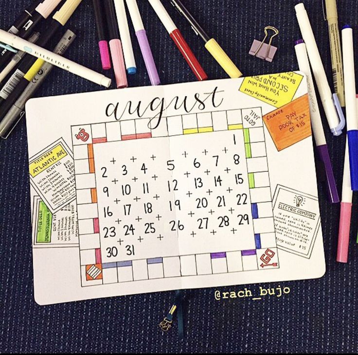 a calendar with crayons and markers on it