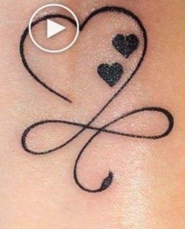 a woman's stomach with two hearts and an arrow tattoo on the back of her stomach