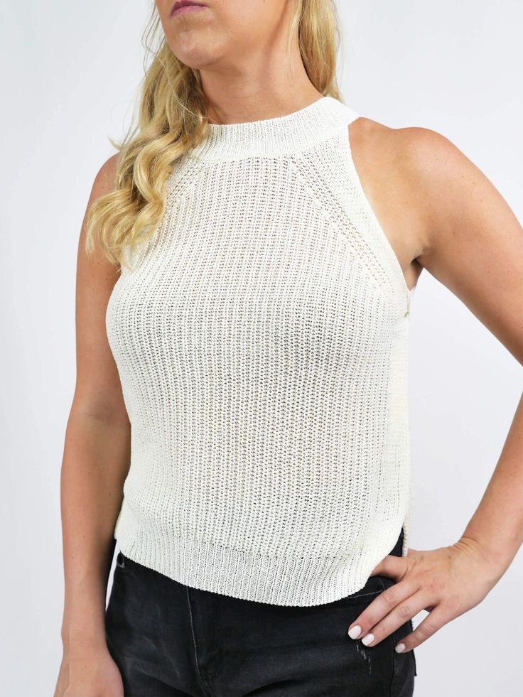 This knit tank features a relaxed fit and a mid-weight material. It is very versatile and can be dressed up or down. FABRIC 96% Rayon, 4% Spandex SIZE & FIT Fits true to size; For a looser fit size up Model is 5'6" wearing size small Summer Textured Knit Tank Top For Layering, White Ribbed Knit Tank Top, Versatile White Tank Top For Layering, Casual Stretch Tank Sweater Vest, Casual Stretch Sweater Vest, Everyday White Ribbed Tank Top, Cotton Textured Knit Tank Top For Layering, Textured Knit Cotton Tank Top For Layering, Spring Knit Tank Top