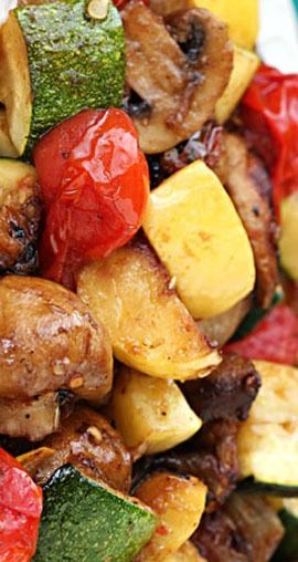 a close up of a plate of food with meat and veggies