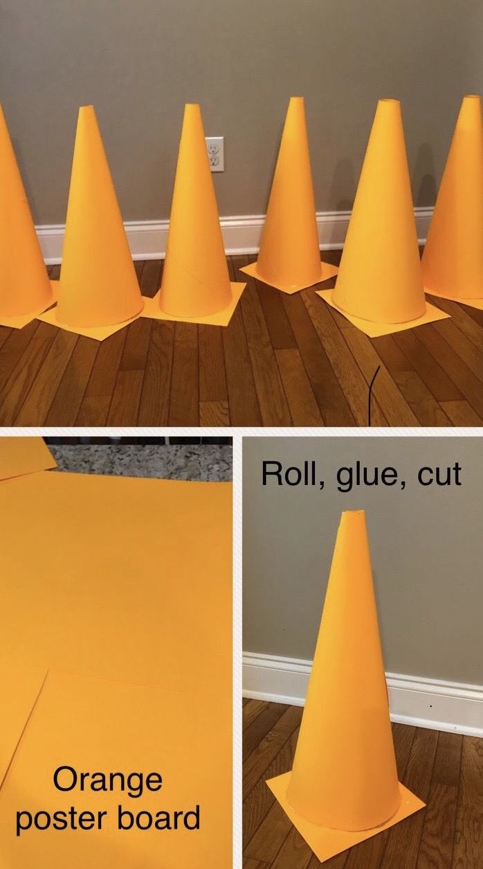 the orange poster board has been placed on the floor to make it look like cones