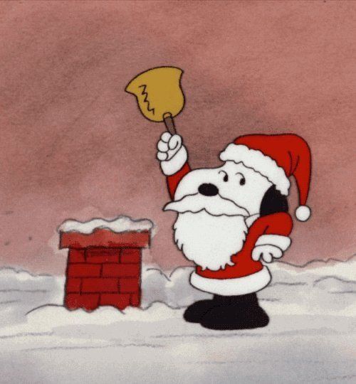 a cartoon santa clause holding up a sign in front of a fire hydrant with snow on the ground