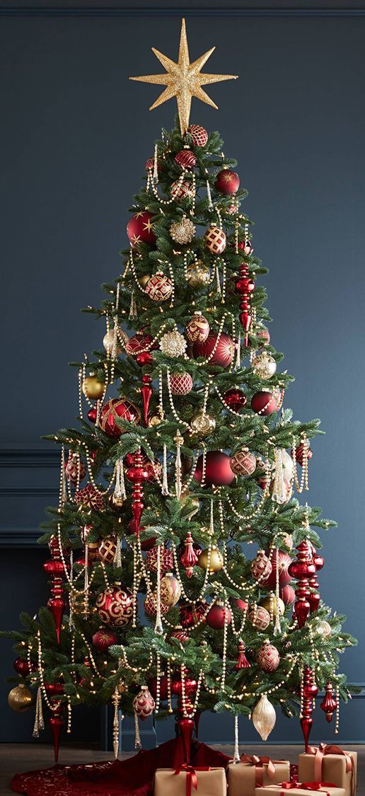 a decorated christmas tree with presents under it