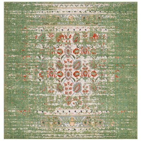 a green and red rug with an ornate design on the bottom, in front of a white background