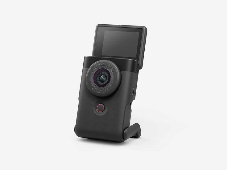 an image of a camera that is attached to a cell phone holder on a white background