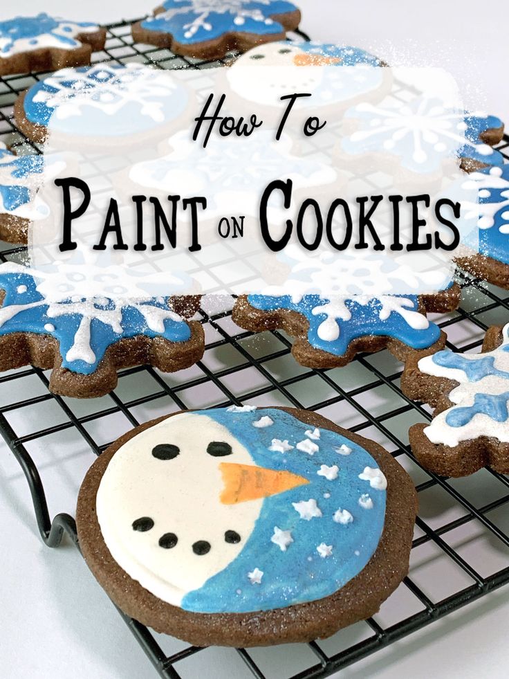 how to paint on cookies that look like they are snowmen and frosted with icing