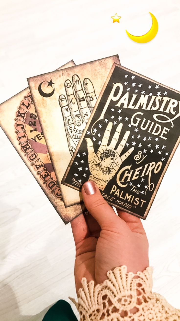 the palmist's guide is held up in front of a white background with stars and crescents